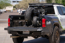 Load image into Gallery viewer, DV8 Offroad UNBM-01 Truck Bed Universal Tire Carrier/Accessory Mount