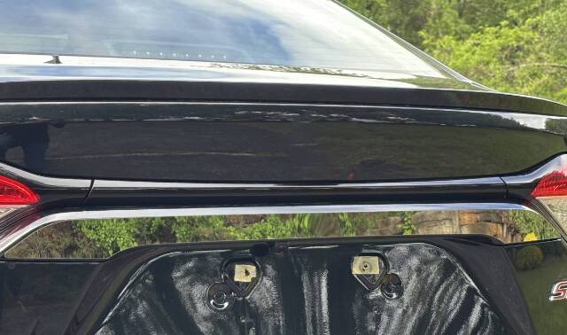 QAA Polished Top License Bar Trim 1Pc Fits 20-26 Corolla Sedan