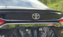 Load image into Gallery viewer, QAA Polished License Plate Bezel 1Pc Fits 20-26 Corolla Sedan