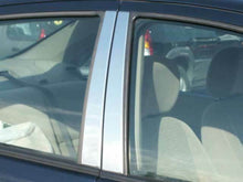 Load image into Gallery viewer, QAA PP44315 Polished Pillar Post Trim 4Pc Fits 00-07 Focus Sedan